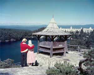 Couple admiring Lake Minnewaska with Wildemre and Summerhouse in background.